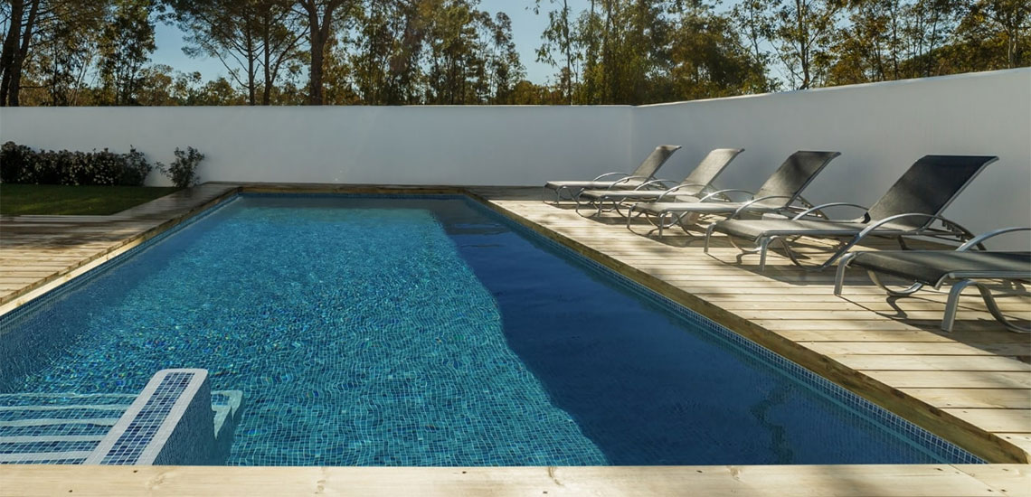 Waxman Aquastyle mosaic tiles around swimming pool